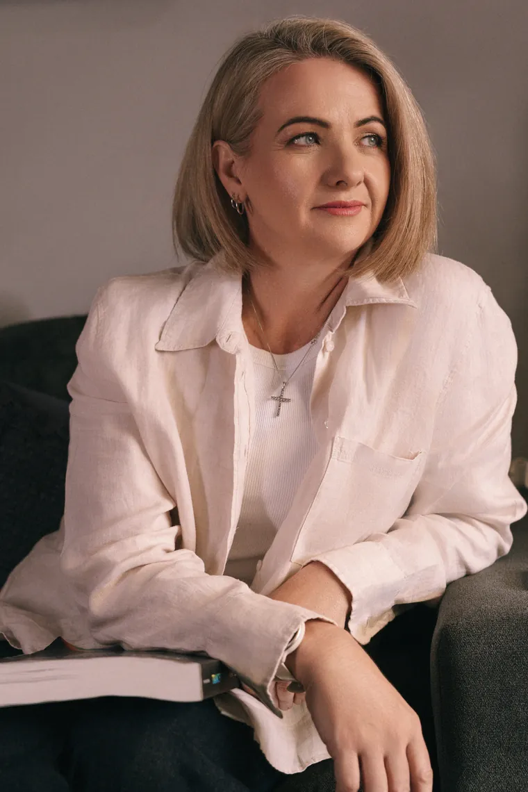 Joanne Graham, clinical hypnotherapist, seated in her consulting room